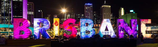 The skyline of Brisbane at night with installation of Brisbane letters in foreground